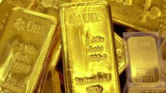 الدولار يهبط بالذهب لأدنى مستوى