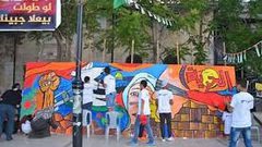 جدارية تضامية مع الأسرى في البيرة