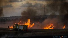 10 حرائق في "غلاف غزة" بفعل بالونات حارقة
