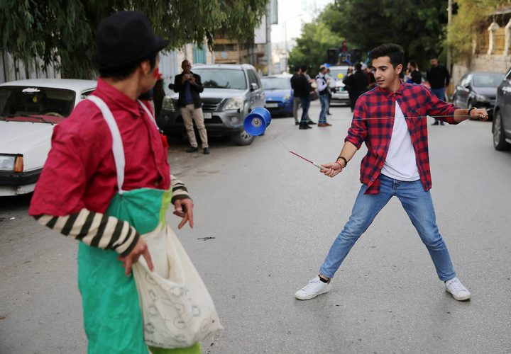 فرقة موسيقية فلسطينية تعزف الموسيقى في الشارع خلال كرنفال الشارع في مدينة نابلس بالضفة الغربية في 28 نوفمبر ، 2018.