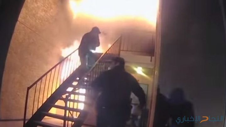 شرطي يلتقط طفلا قفز من نافذة بيت يحترق! (فيديو)