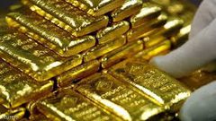 الذهب يتراجع مع صعود الدولار والأسهم