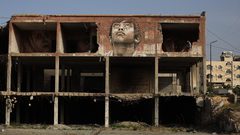 "حلم بين الركام" رسام من غزة يعيد الحياة لمبنى دمره الاحتلال