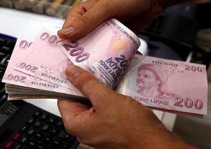 الليرة التركية تهوي إثر إقالة اردوغان محافظ البنك المركزي