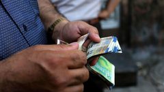 اتحاد المستهلك يدعو للتعامل بالدينار بدل الشيكل