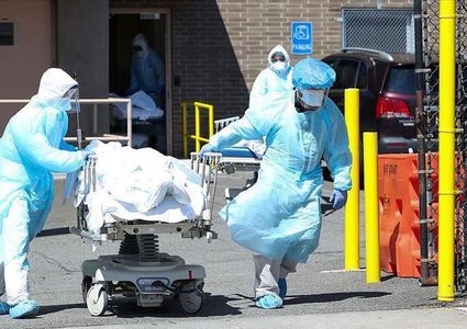 تفشٍ قياسي لكوفيد في الولايات المتحدة وبدء التلقيح في روسيا