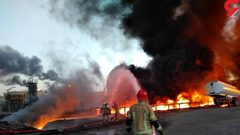 التلفزيون الإيراني: النيران تشتعل في 18 خزانا للنفط