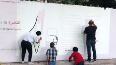 إعادة رسم جدارية فلسطين في الناصرة