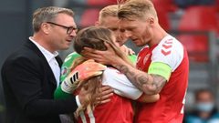 انهيار زوجة اللاعب إريكسن بعد سقوطه مغشيا عليه