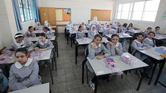 عودة الطلاب إلى مدارسهم صباح اليوم الأول من العام الدراسي الجديد في مدينة غزة