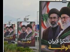 بيروت: إزالة لافتات مؤيدة لإيران قرب المطار واستبدالها بعبارة “لبنان أولًا”
